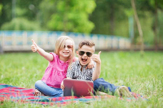 I love my little brother Shot of an adorable brother and sister taking a selfie together while bonding outside