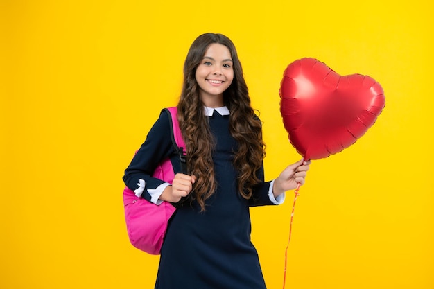 I Love school Schoolgirl on the last day of school with balloons Teenager child school girl school