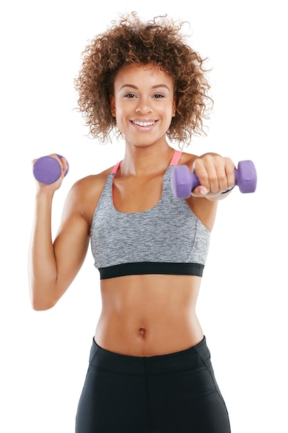 I love the way exercise makes me feel Studio shot of a fit young woman lifting weights against a white background