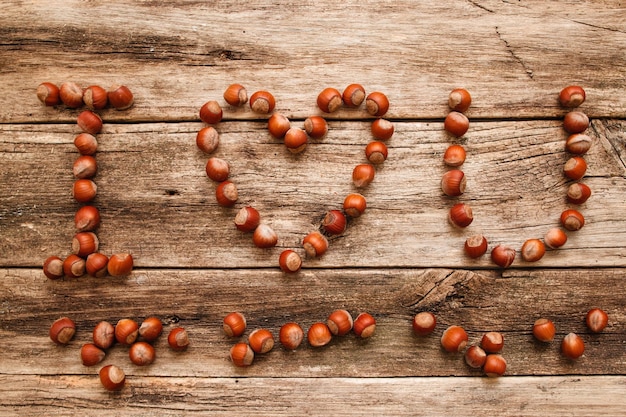 I love you from hazelnuts on wood flat lay