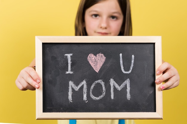 Photo i love you mom message written on blackboard