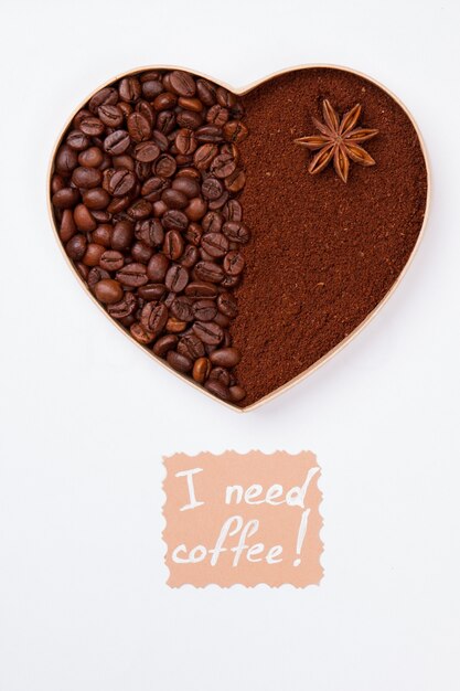 I need coffee. Coffee heart of beans and instant coffee powder. Isolated on white surface.