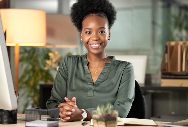 I smile because Im successful. Cropped portrait of an attractive young businesswoman working at her desk in the office.