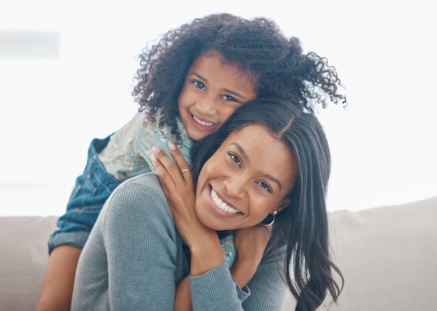 I sustain myself with the love of family. Shot of a mother and her little daughter relaxing together at home.