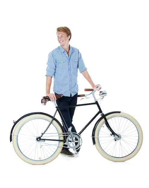 I take things slow A handsome young redheaded man standing next to an oldfashioned bicycle