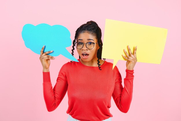 I Think. Pensive afro woman looking at blank speech bubble, touching her chin, copyspace, pink studio wall