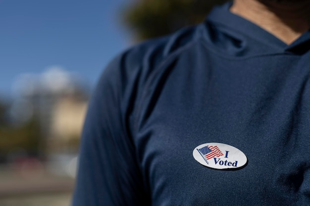 I Voted sticker stuck on a voter39s shirt Elections 2024 United States