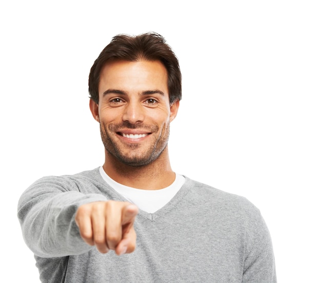 I want you A handsome young man pointing at you against a white background