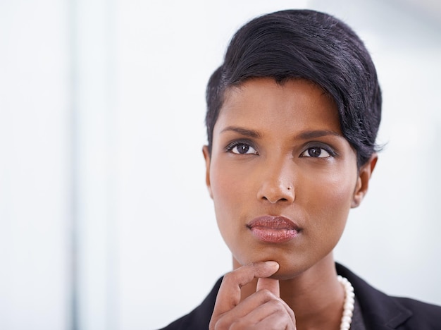 I wonder Shot of an attractive young woman businesswoman in her office