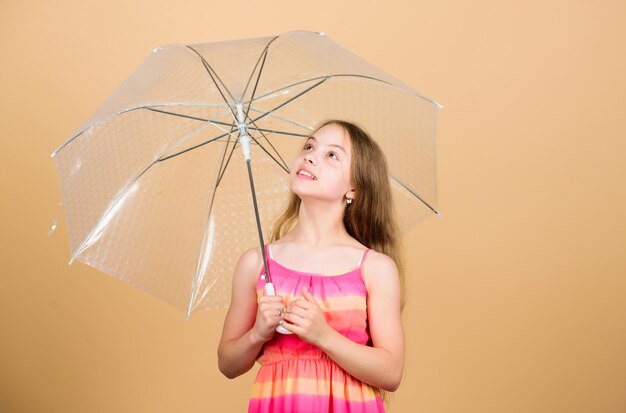 I would stay here forever autumn fashion rainy weather Fall mood carefree childhood small girl with umbrella autumn weather forecast child with trabsparent parasol