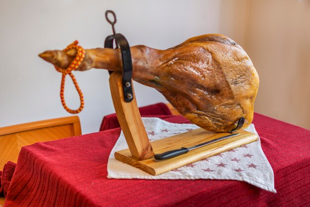 Iberian ham on red tablecloth