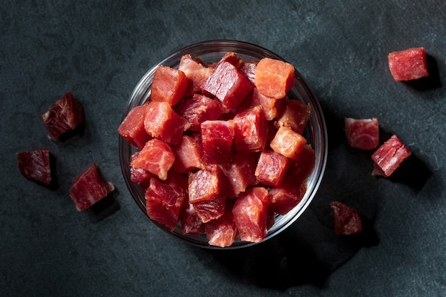 Photo iberian ham (serrano) cut into cubes (diced)