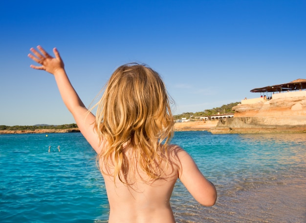 Ibiza Cala Conta little girl greeting hand sign