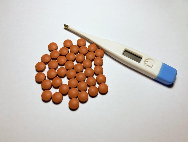 Ibuprofen and an electronic thermometer for measuring temperature