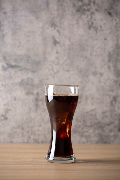 Ice americano coffee on wood table in coffee shop loft style