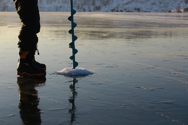 Ice ax ice screws on winter fishing on the ice caves Ice is very clean and beautiful The Lake Baikal