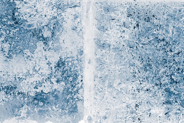 Photo ice blocks surface blue toned ice texture background textured cold frosty surface of ice blocks