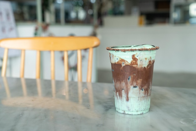 ice chocolate mint milkshake glass on table