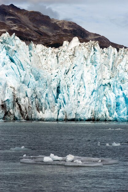 Ice Chunks Dwarfed by Mountains Aialik Glacier Alaska Kenia Fjords