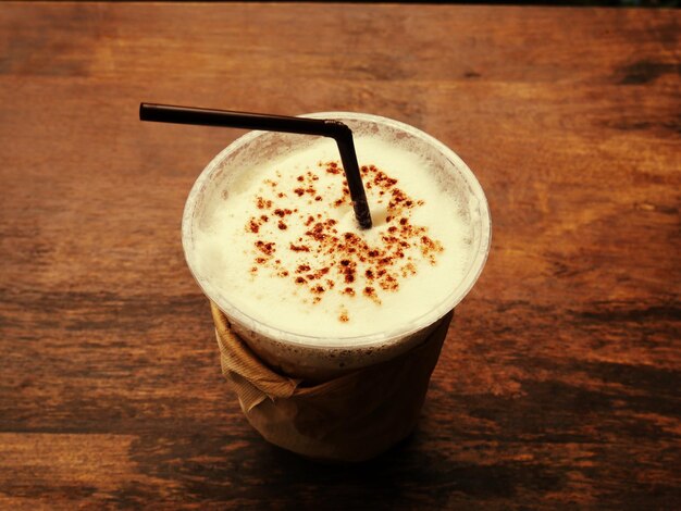 Ice coffee on wooden table