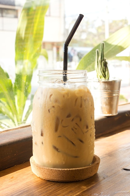 Ice coffee on wooden table.