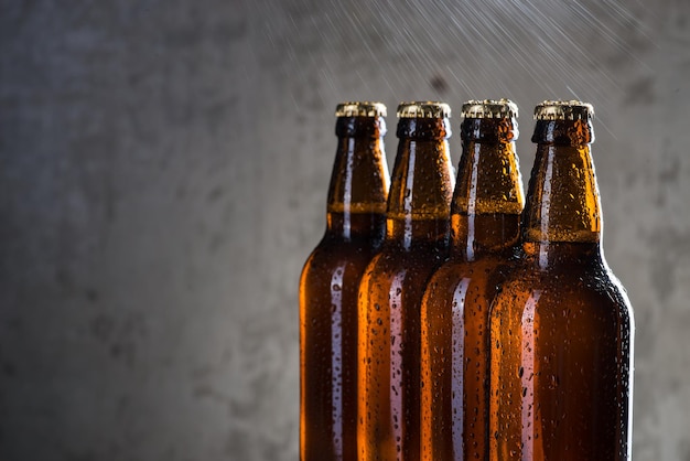 Ice cold beer bottles with drops of dew