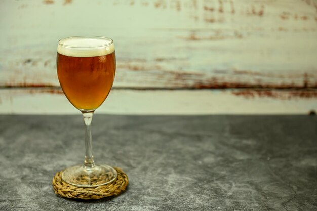 Ice cold beer glass on white background copy space