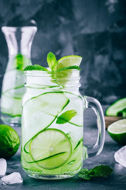 Ice cold and refreshing detox water cucumber and mint in a glass jar