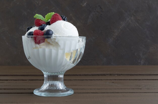 Ice cream balls in a glass vase.