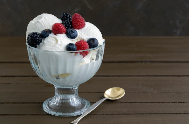 Ice cream balls in a glass vase.