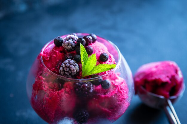 Ice cream on black stone background.