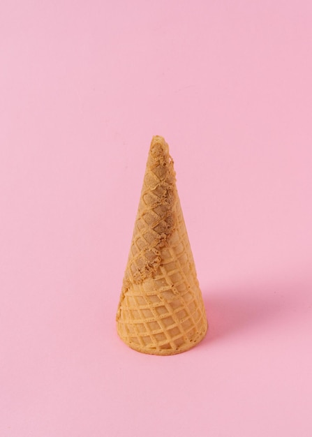 Photo ice cream cone on a light pink background.