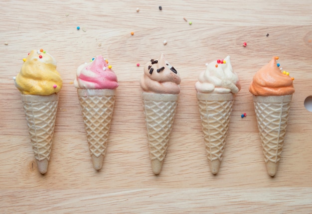 Ice cream cone models on wooden board