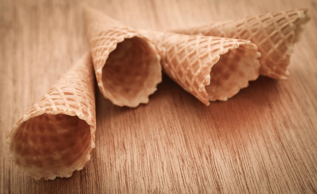 Ice cream cone on timber surface