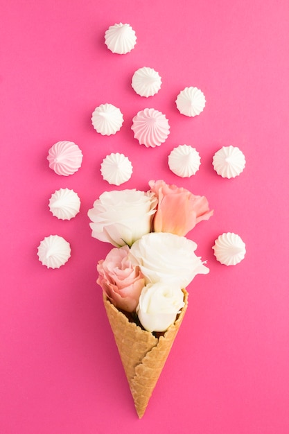 Ice cream cone with flowers and meringue