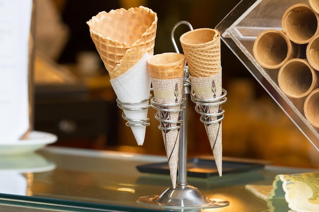 Ice cream cones on a stand in a store