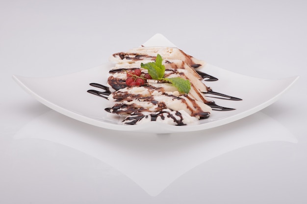 Ice cream in a dish on a white background