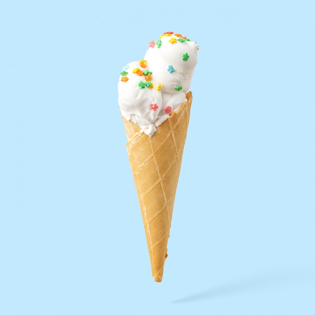 Ice cream in a horn on a blue background.