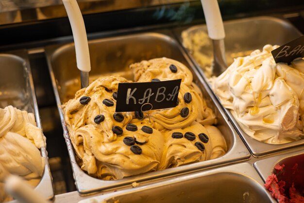 ice cream in iron trays on the store counter