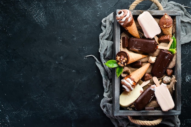 Ice cream A large selection of ice cream On a stone background Top view Free copy space