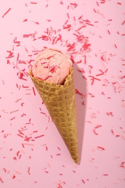 Ice cream on pink background with sprinkles