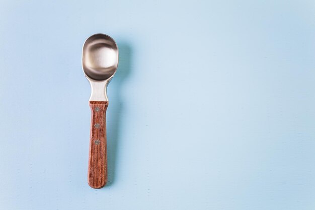 Ice cream scoop on a blue background.