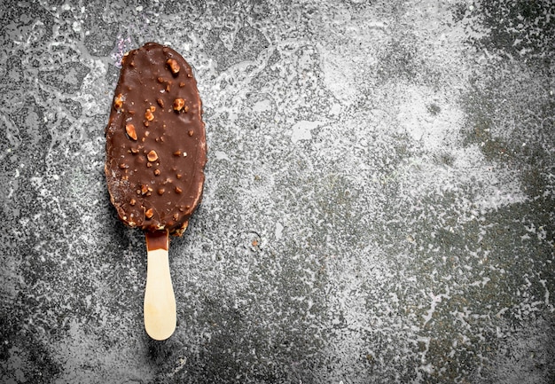 Ice cream on a stick covered with chocolate