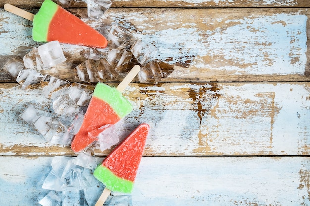 Ice cream sticks on a wooden background