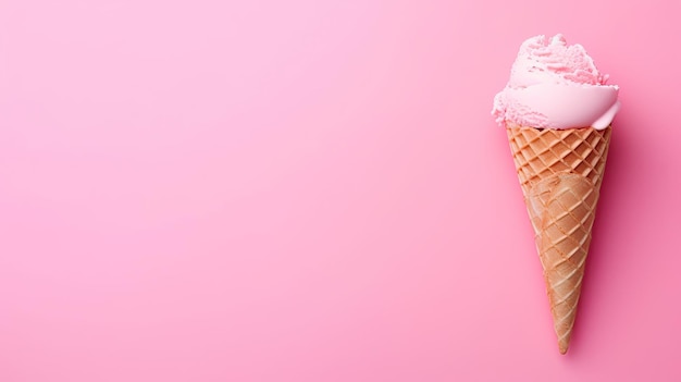 Ice cream in a waffle cone on a pink background with copy space