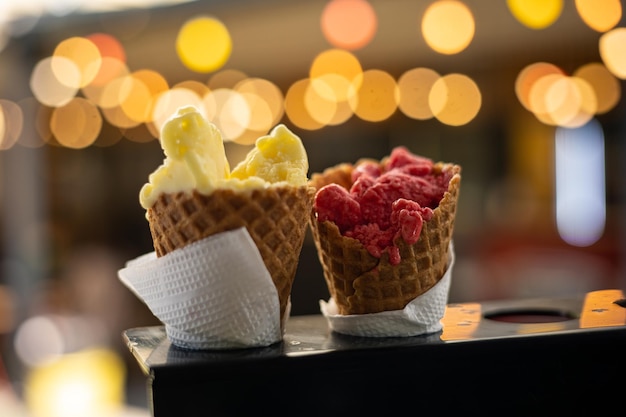 Ice cream in waffle cone on a store counter