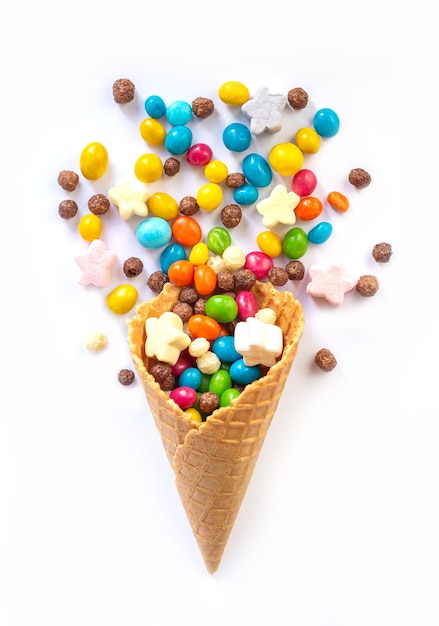 Ice cream waffle cone with candy isolated on white background