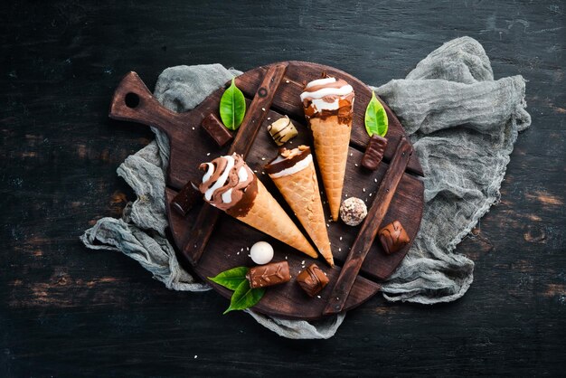 Ice cream in a waffle cup on a black background Top view Free copy space