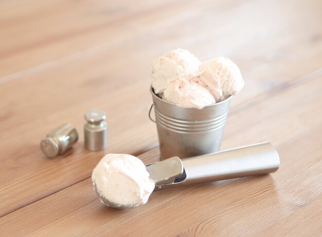 Ice cream with caramel sauce on dark gray table