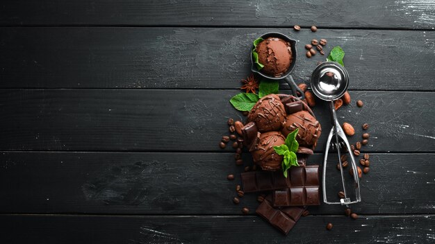 Ice cream with chocolate Making ice cream on Wooden background Top view Free space for your text